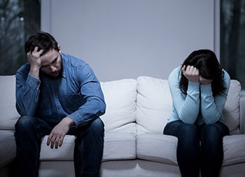 Couple struggling with legal decisions related to marital separation - Aminu Law Firm, PLLC